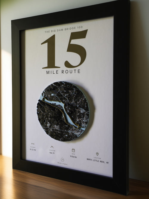 THE MARKER, 15 mile route of the Big Dam Bridge 100 — framed relief map viewed at an angle, showing the raised terrain and the brass route line
