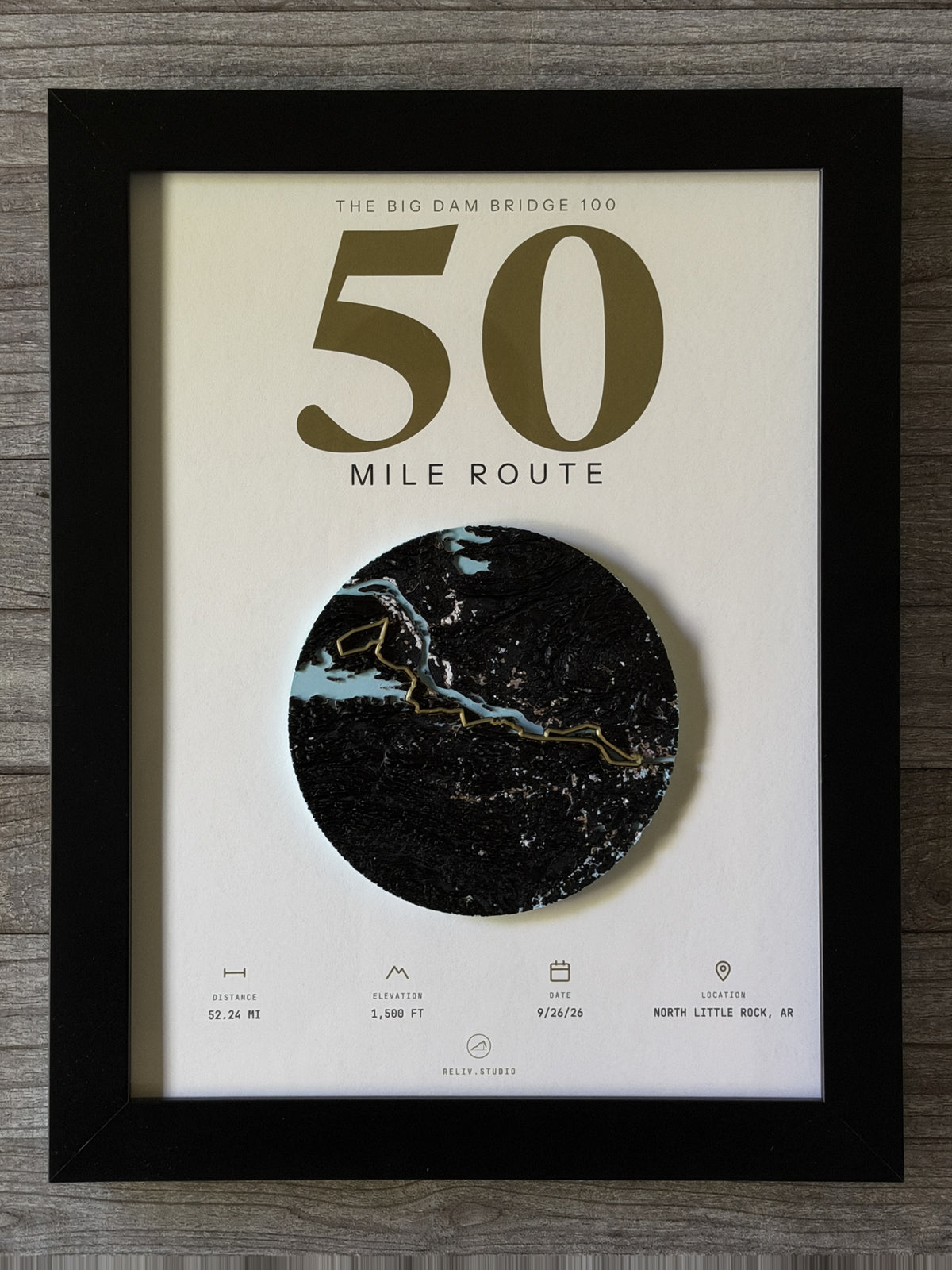 THE MARKER, 50 mile route of the Big Dam Bridge 100 — framed dimensional relief map in a black wood frame, shown front on